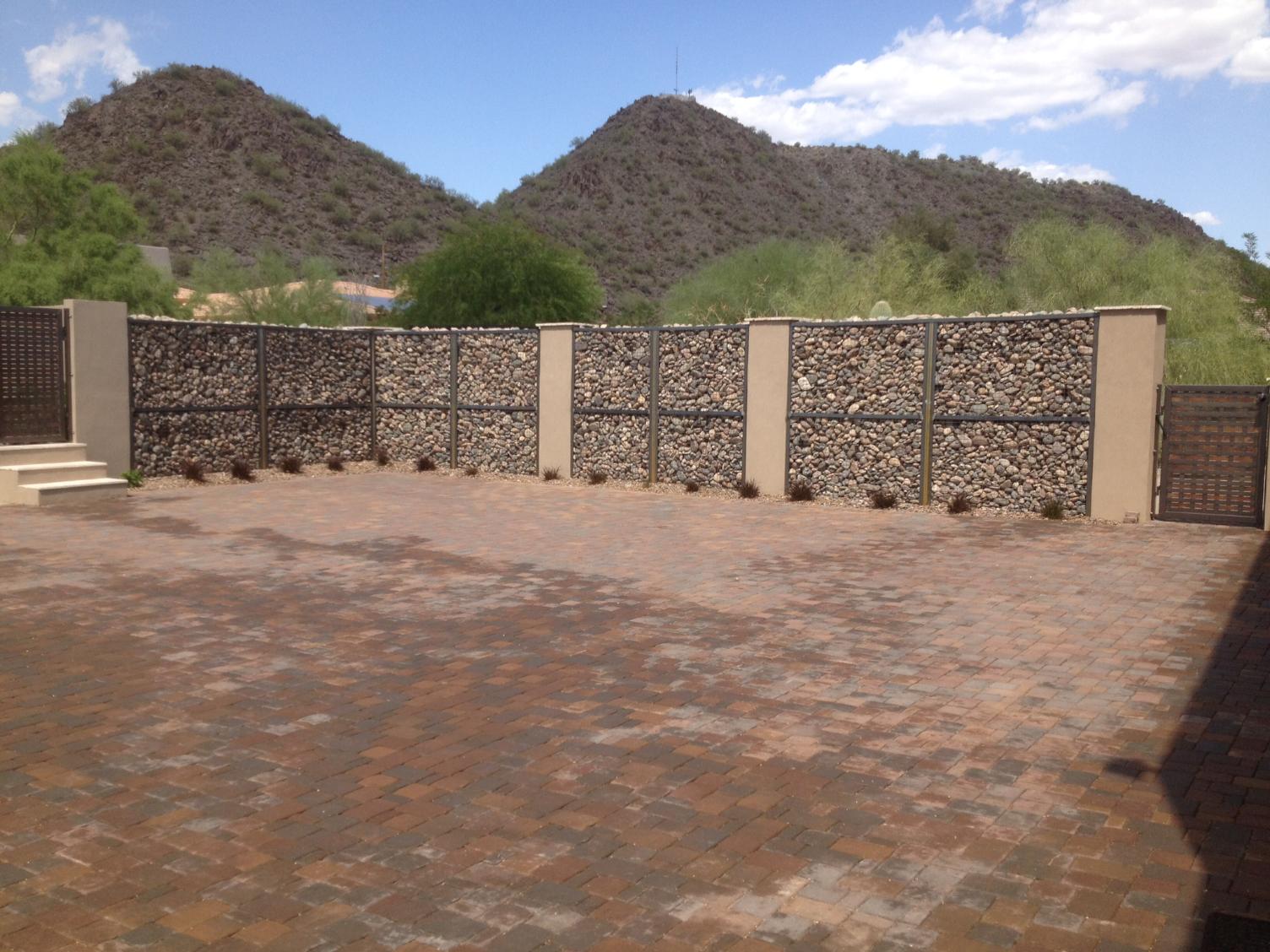 Stone patio with built-in fire pit and seating area