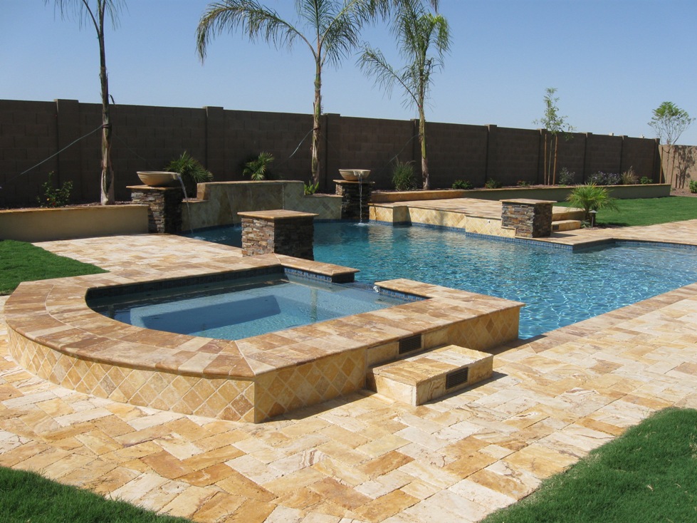 Elegant water feature with pool and waterfall in a backyard